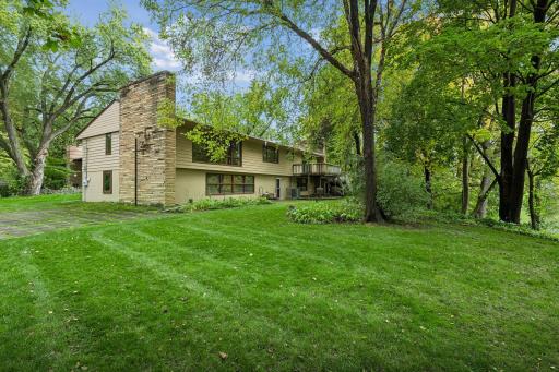 Spacious side yard offer room for play, outdoor gatherings, or potential home expansion.