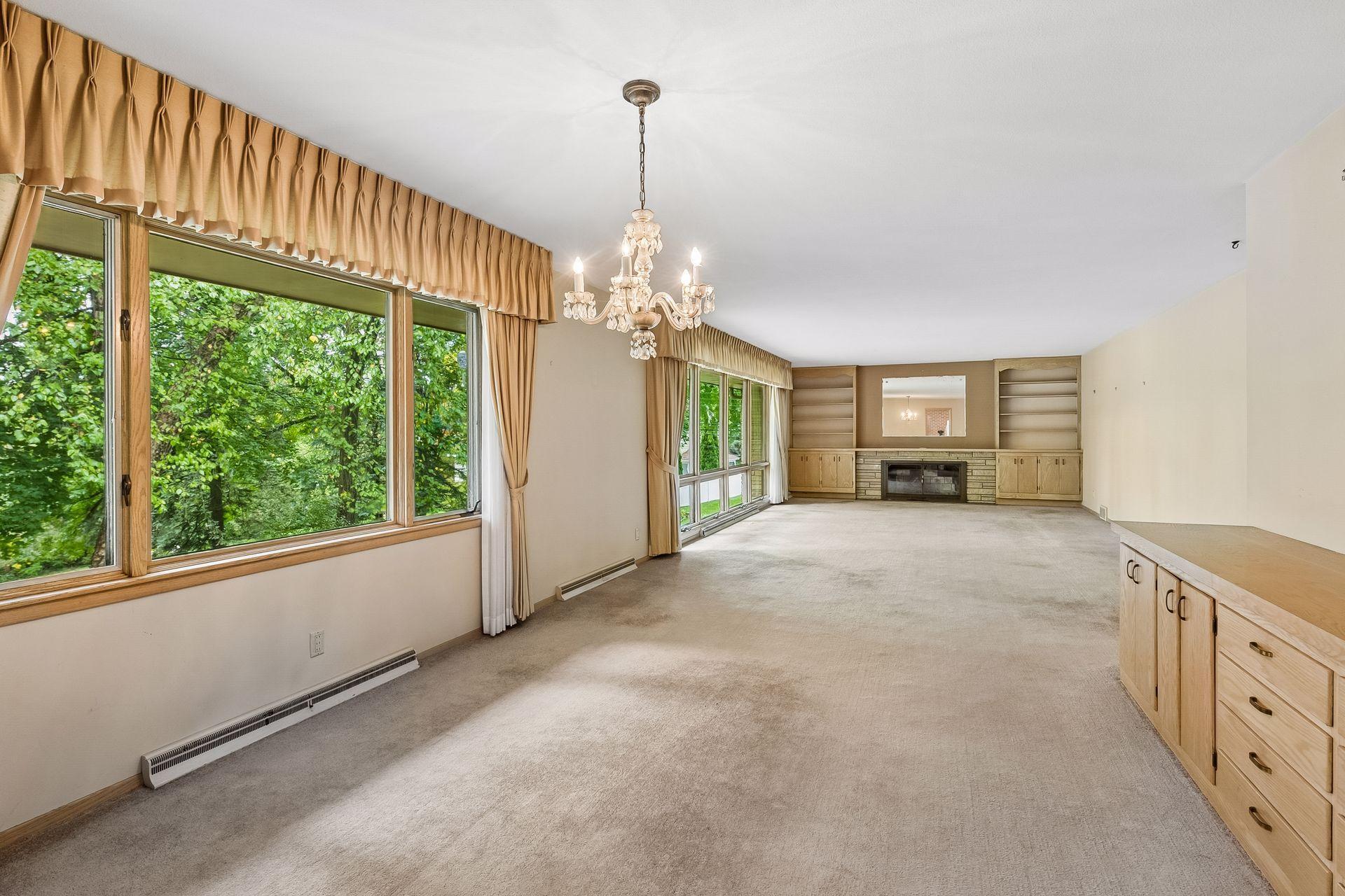 Expansive, connected living and dining areas offer a versatile layout with plenty of room for gathering and entertaining.