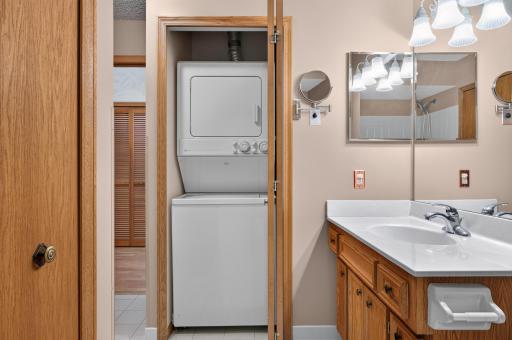Main level laundry, easy to access, stackable Maytag unit (with top load washer).