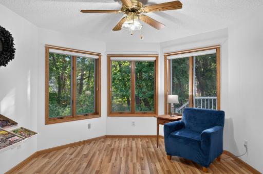The sunny den offers a peaceful place to read, puzzle, work or relax, with a door leading directly to the patio. Outside, enjoy a private deck overlooking lush, wooded viewsâa beautiful backdrop for morning coffee or evening sunsets.