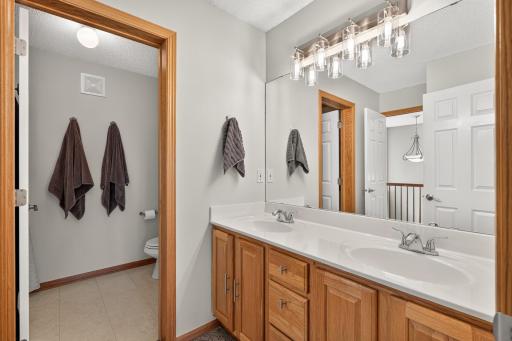Double sinks and large vanity plus a private lavatory in the full Bath.