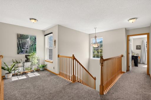 Let's head upstairs. At the top of the landing you will find a sunny alcove - perfect for the plants or even the treadmill?