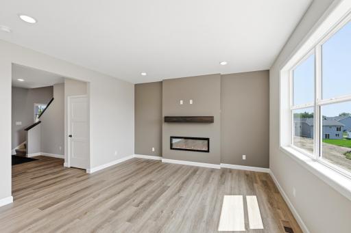 Living room - photos of a completed home of the same floorplan. Colors and selections may differ.