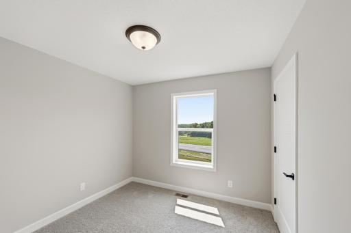 Bedroom - photos of a completed home of the same floorplan. Colors and selections may differ.