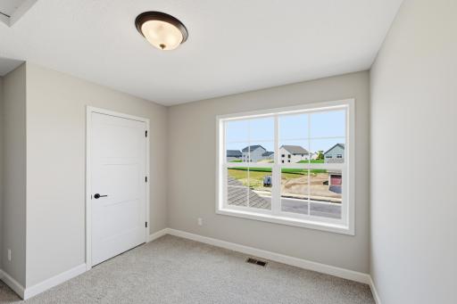 Bedroom - photos of a completed home of the same floorplan. Colors and selections may differ.