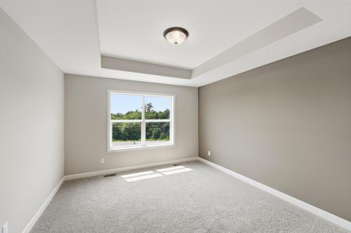 Primary suite - photos of a completed home of the same floorplan. Colors and selections may differ.