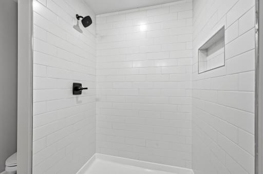 Primary suite luxury shower - photos of a completed home of the same floorplan. Colors and selections may differ.