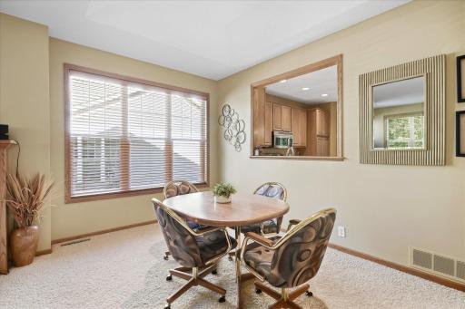 Dining area features a beautiful tray-vaulted ceiling and an open layout perfect for entertaining!