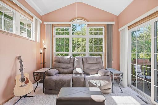 Relax year-round in the sun-filled four-season porch surrounded by peaceful tree-lined views!