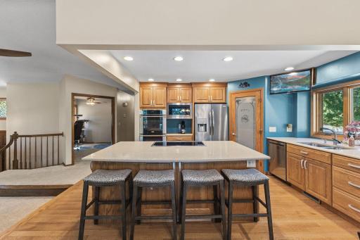 1615 Laurel Ave kitchen with island, double oven, cooktop with bedroom 2 in the background