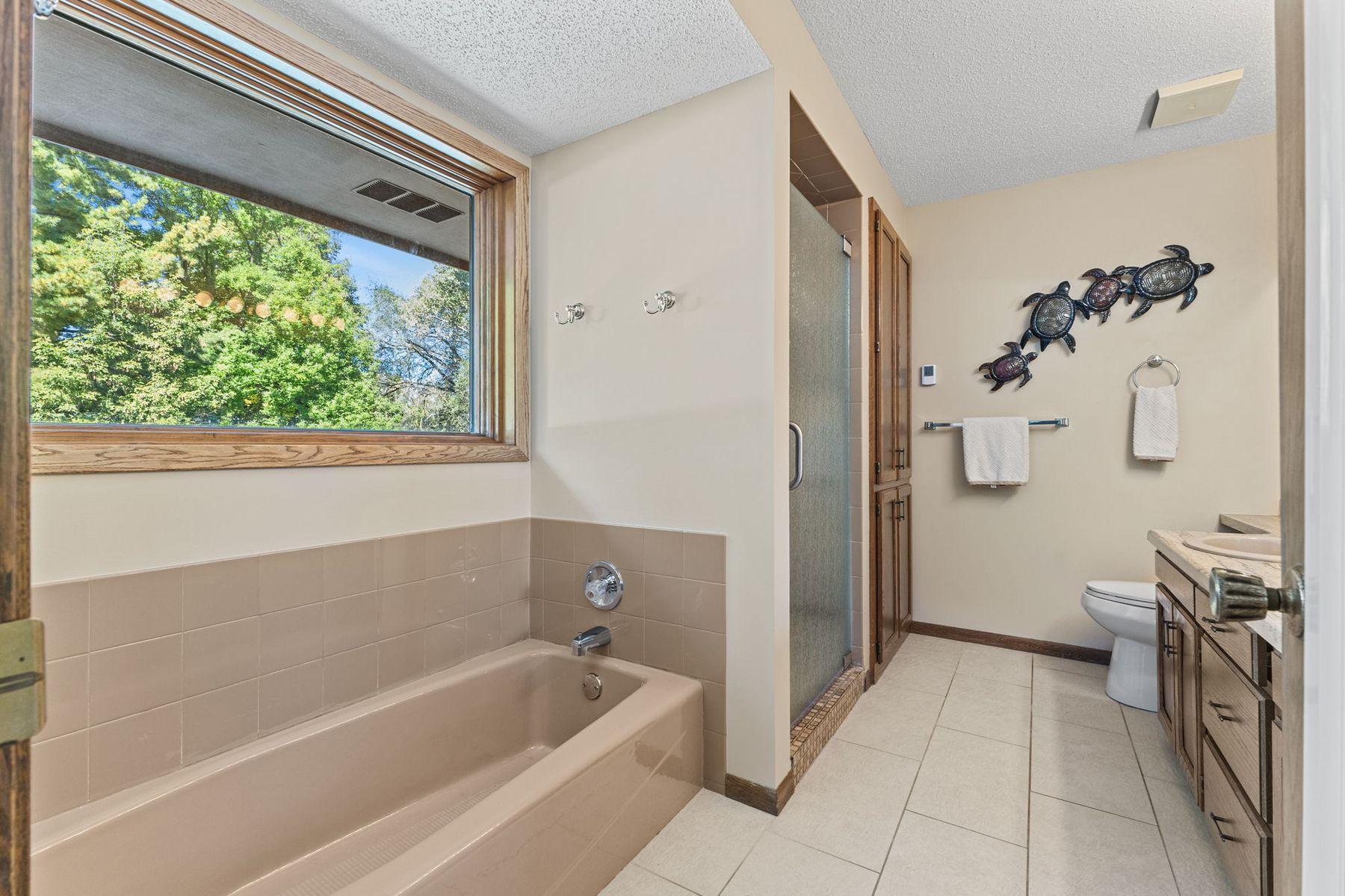 1615 Laurel Ave Primary Bath with tub and separate walk in shower