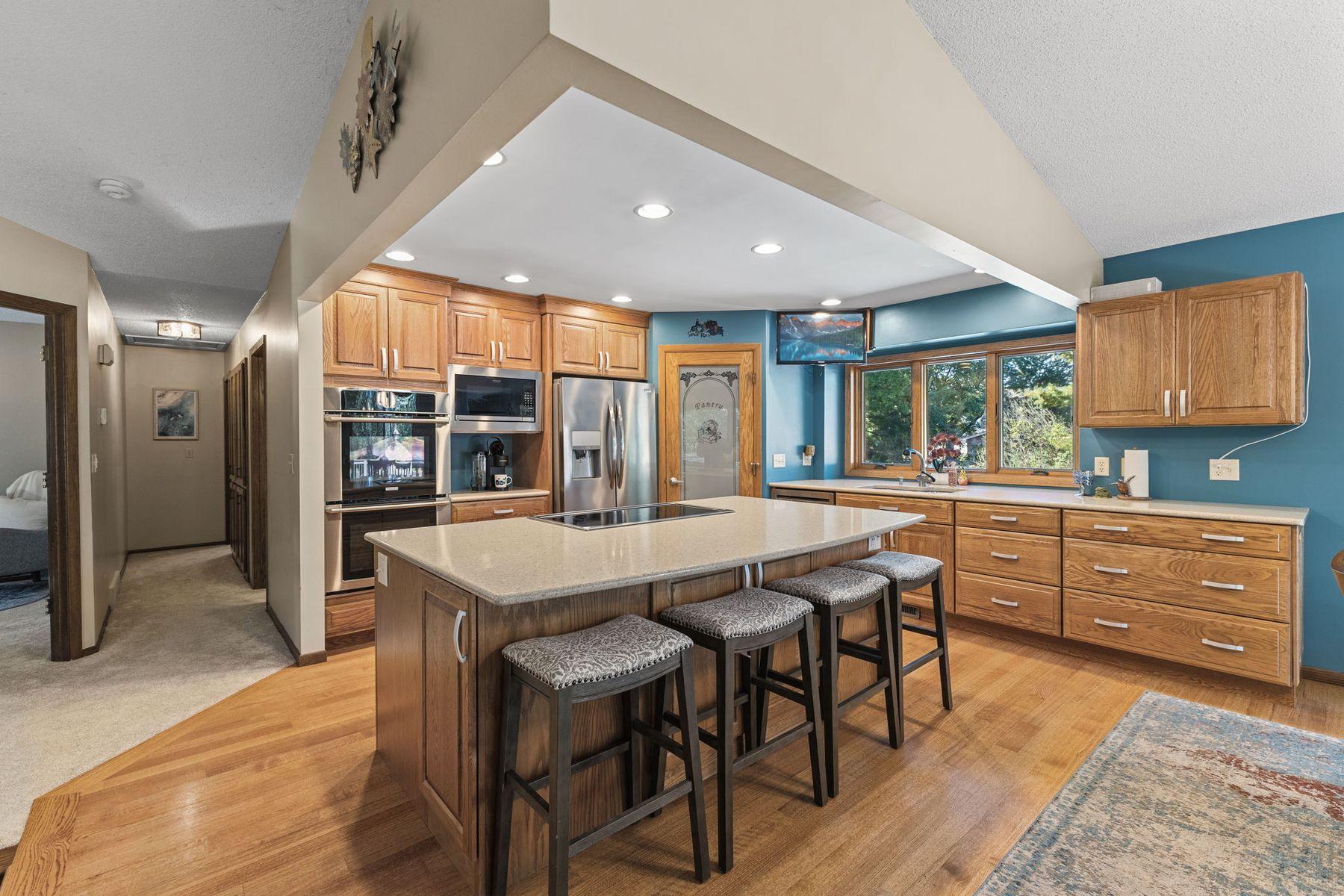 1615 Laurel Ave Kitchen with walkin pantry over looking the in ground swimming pool