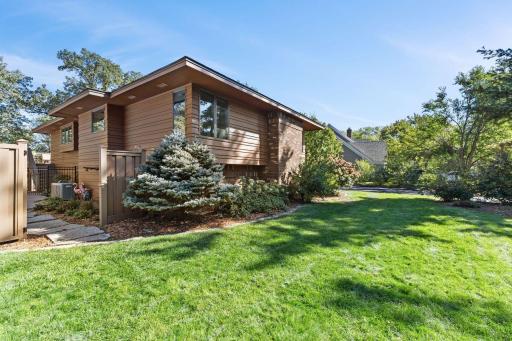 1615 Laurel Ave Sideview of the home. Gate opens extra wide for ease access to the pool.