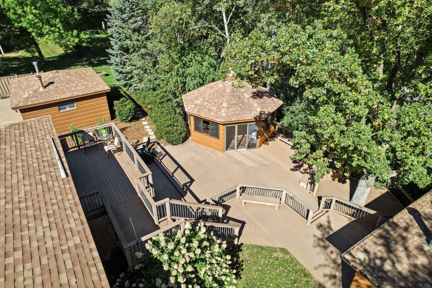 1615 Laurel Ave Pool house, Gazebo with hot tub, and 16X22 heated and a/c workshop all connected by a multi tiered maintenance free deck.