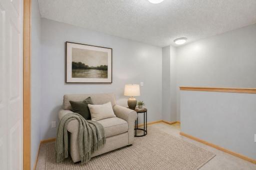 Upper level BONUS loft area virtually staged.