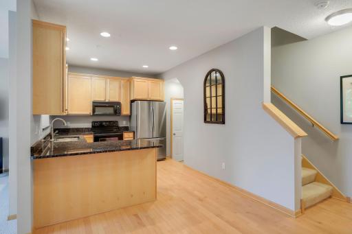 There is a convenient pantry to the right of the refrigerator. Beautiful hardwood floors in the kitchen, dining room and 1/2 bathroom.
