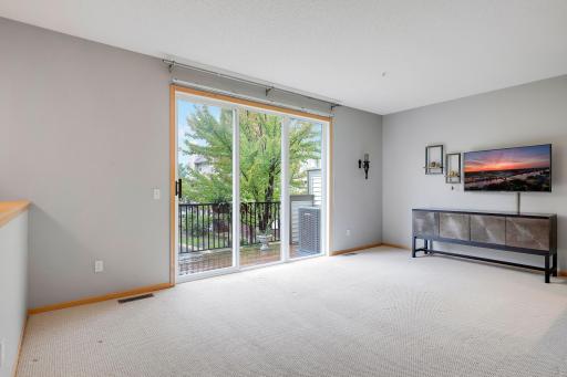 Current living room that leads to your deck to enjoy the view of trees.
