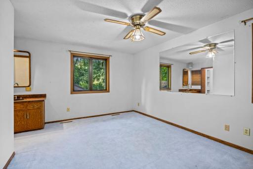 Main Level Primary offers private, vanity space.