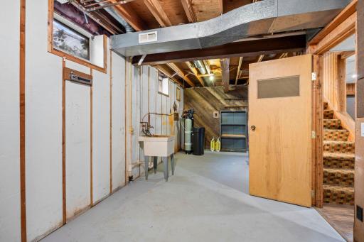 Unfinished basement space offers great storage or future flex room!