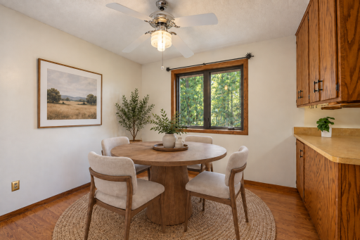 Informal dining located off the kitchen. (Virtually staged to highlight this space)