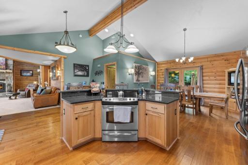 The kitchen and dining area open to the great room