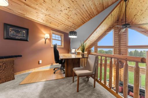 Upper level loft is a great office, art studio or reading nook