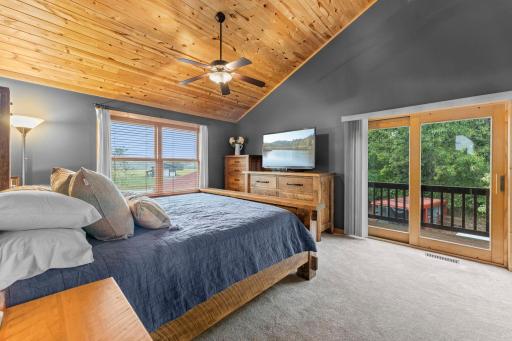 Upper level primary bedroom with private deck