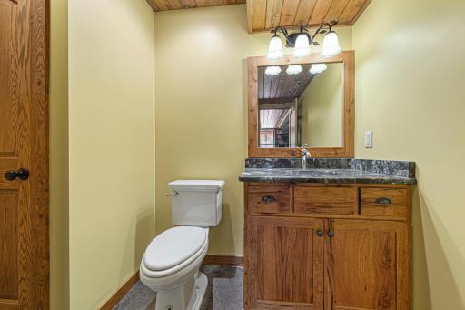 The lower level bathroom features a granite topped vanity.
