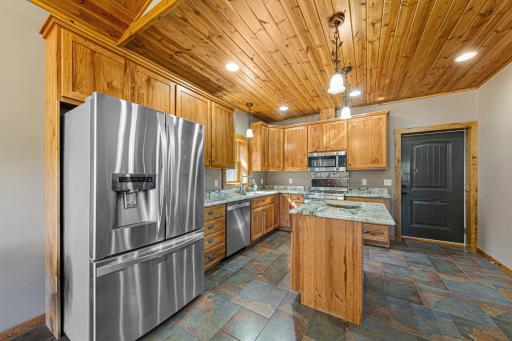 The kitchen features a full suite of S.S. appliances.