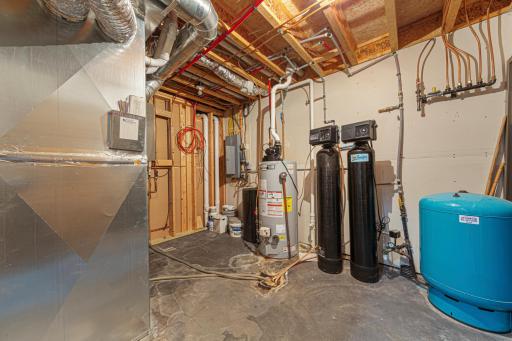 Mechanicals include an owned water softener, a gas water heater, forced air heat, central air, and a Lennox water filtration system.