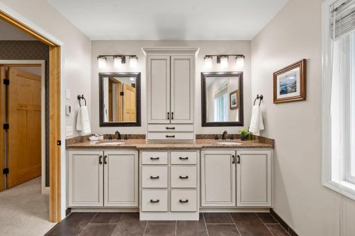 The sizable ensuite includes a double vanity with abundant storage.