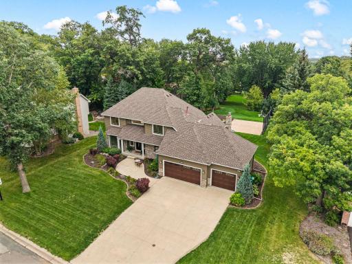 Outside, the setting delivers. A large front patio space overlooks the mature neighborhood.