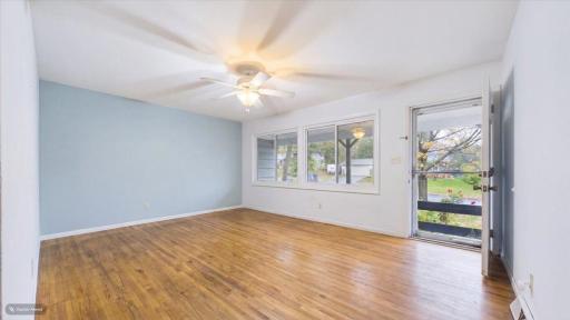 living room, large windows, hardwood floors