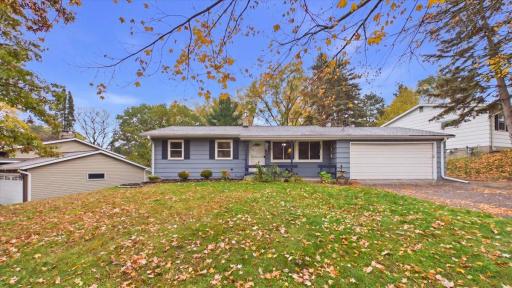 one level living living, attached two car garage with front porch, newer roof,