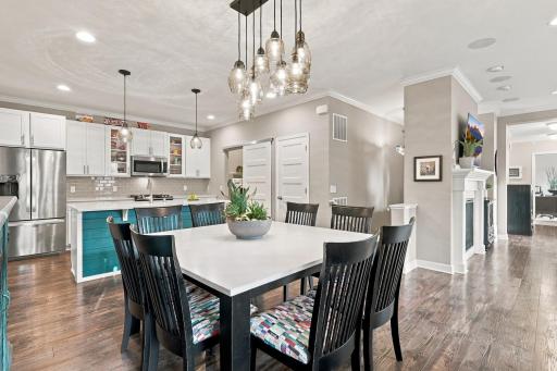 Spacious informal dining area with custom lighting fixture