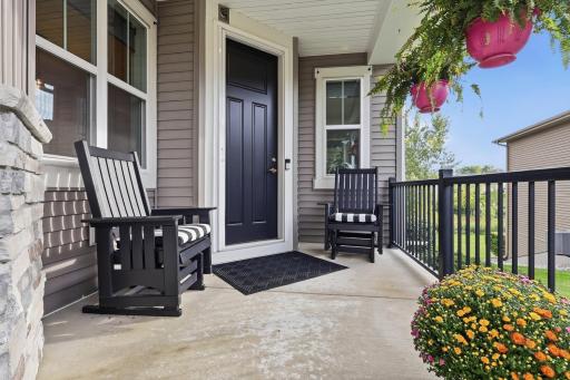 Your covered entry and stately 8 foot entry door with phantom screen