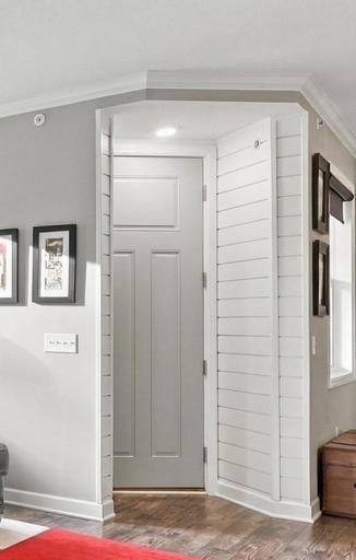 Shiplap details & 8 foot door present an elevated entry