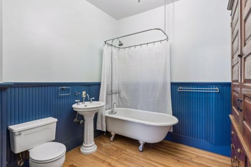 Upper level full bathroom is complete with clawfoot tub.