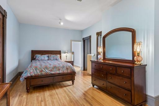 The primary bedroom features a walk in closet and additional sitting room.