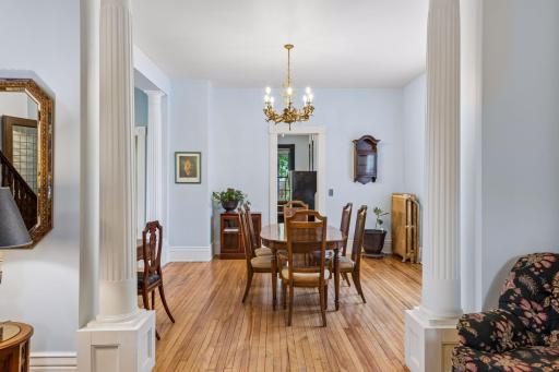 Fluted columns open to the formal dining room