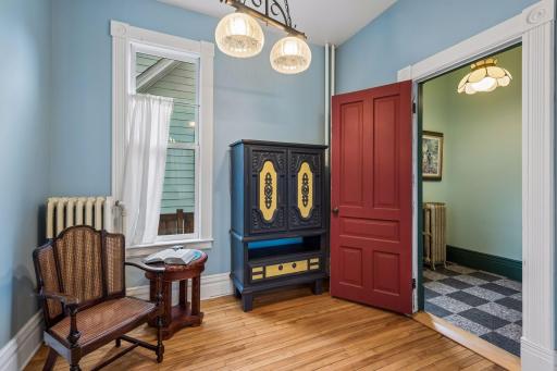 Off of the dining room is a cozy sitting nook that leads to the main level half bathroom.
