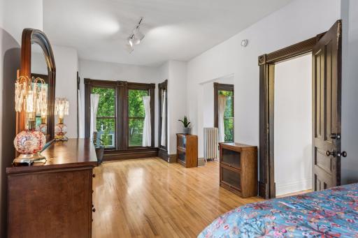 Alternate view of the primary bedroom with adjacent sitting room.