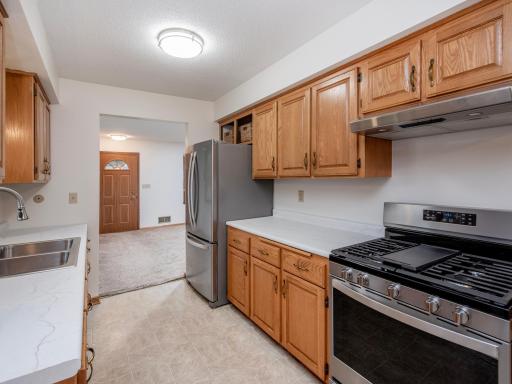 Spacious kitchen featuring stainless steel appliances and plenty of storage space.