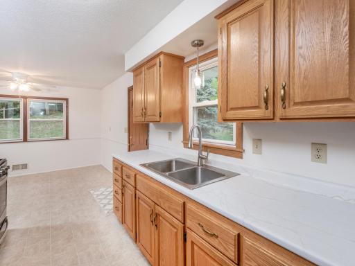 The kitchen is open to the dining area with easy access to the backyard.