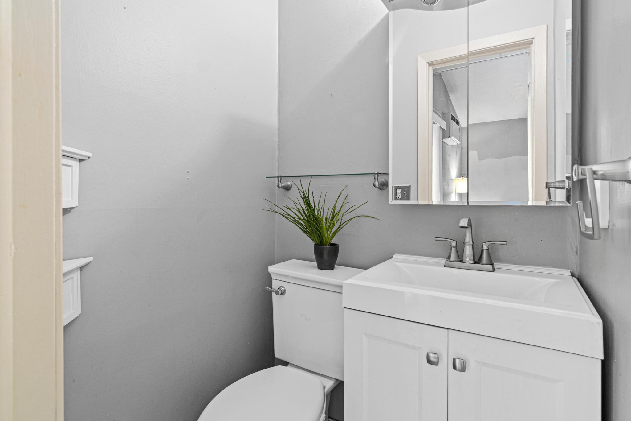 The recently updated, private half bath adds convenience and a touch of privacy to this inviting space.