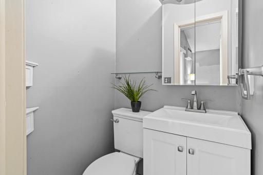 The recently updated, private half bath adds convenience and a touch of privacy to this inviting space.