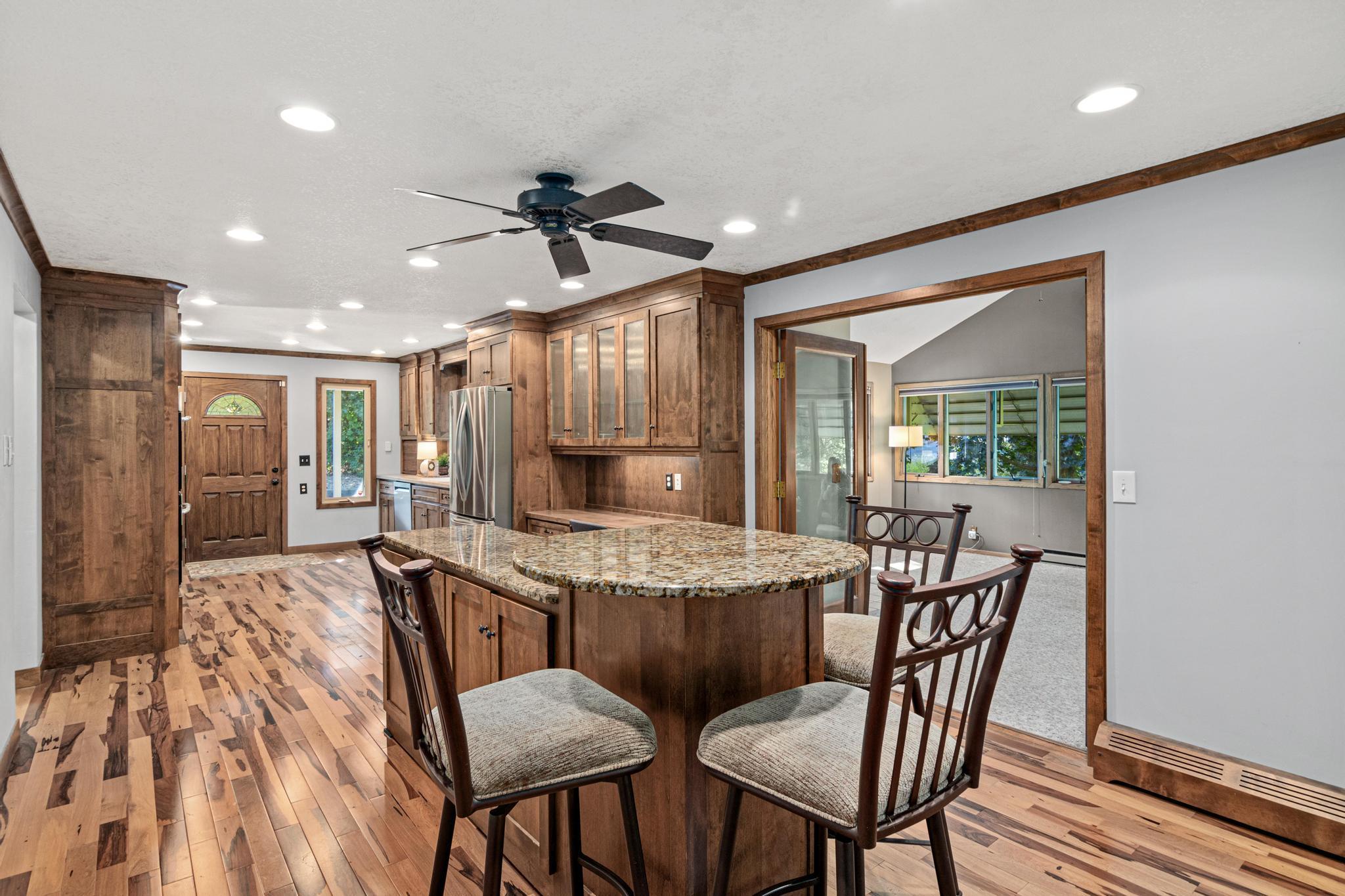 An inviting dining room area offers a welcoming setting for both everyday meals and memorable gatherings. This island can be moved into the kitchen, and a large dining room table can fit in this space as well.