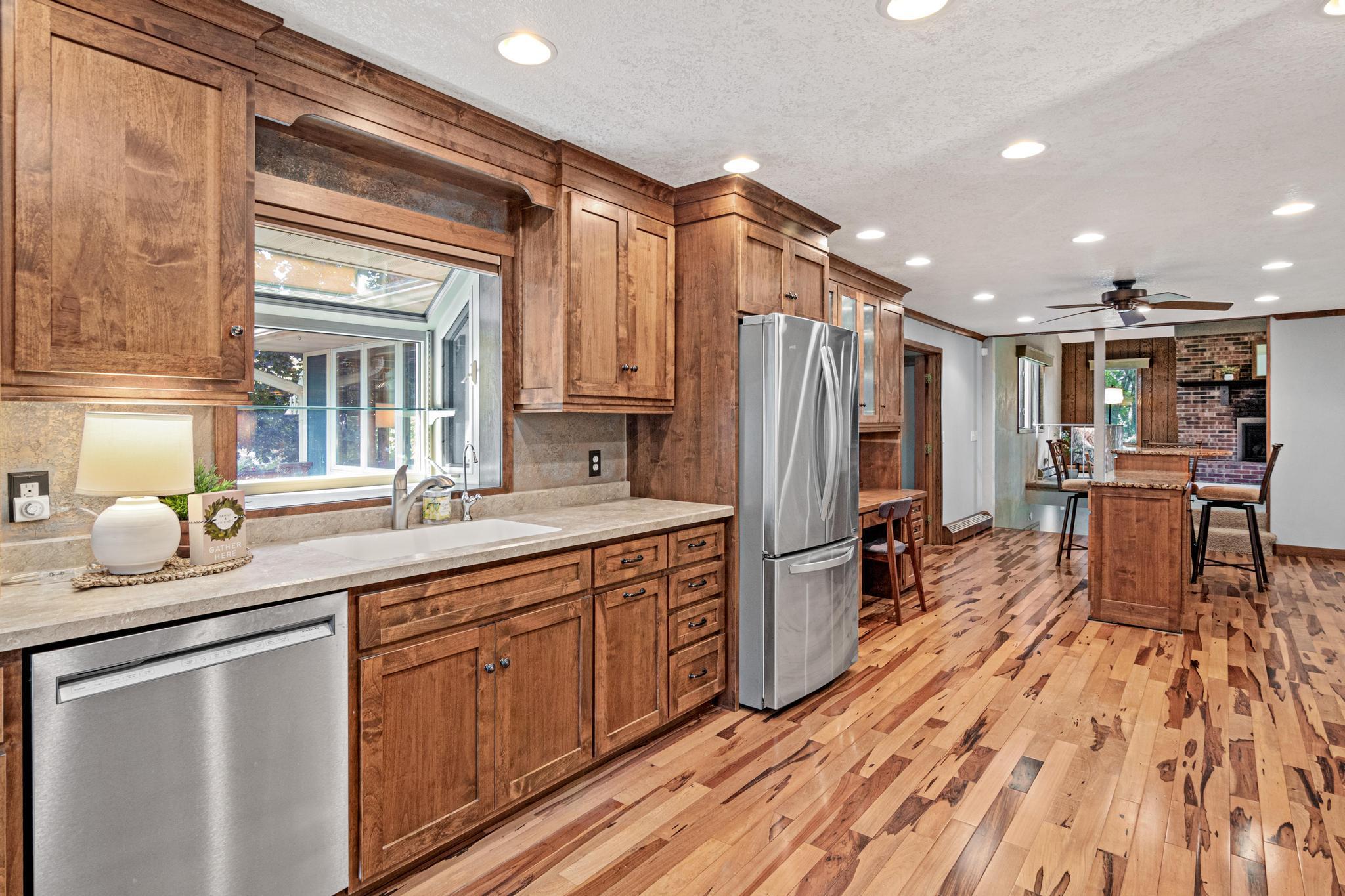 Designed with plenty of storage and workspace, the kitchen provides a welcoming setting for preparing meals, gathering and entertaining.