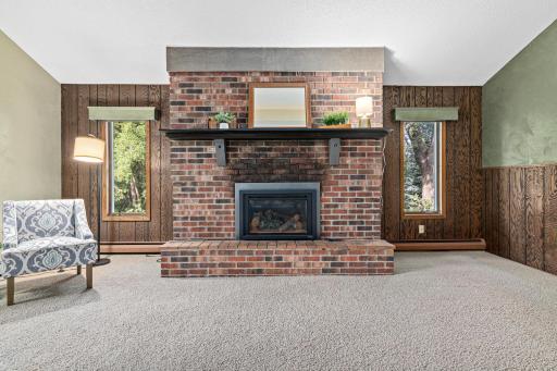 Snuggle up with a favorite book while sitting by the gas fireplace in the living room.