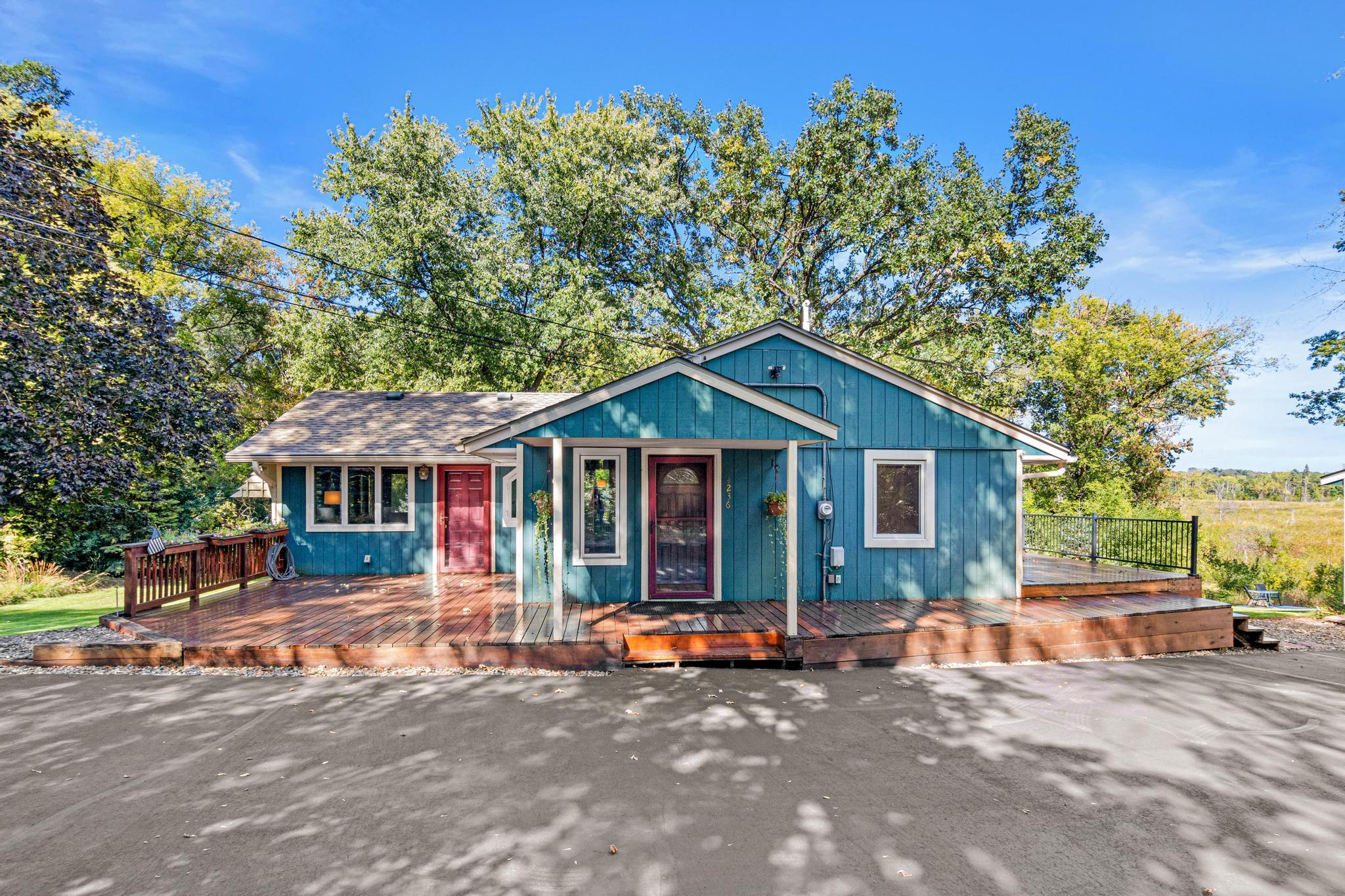 Charming entrance greets family and friends, large wrap around deck allows for entertaining outdoors enjoying your views and yard.